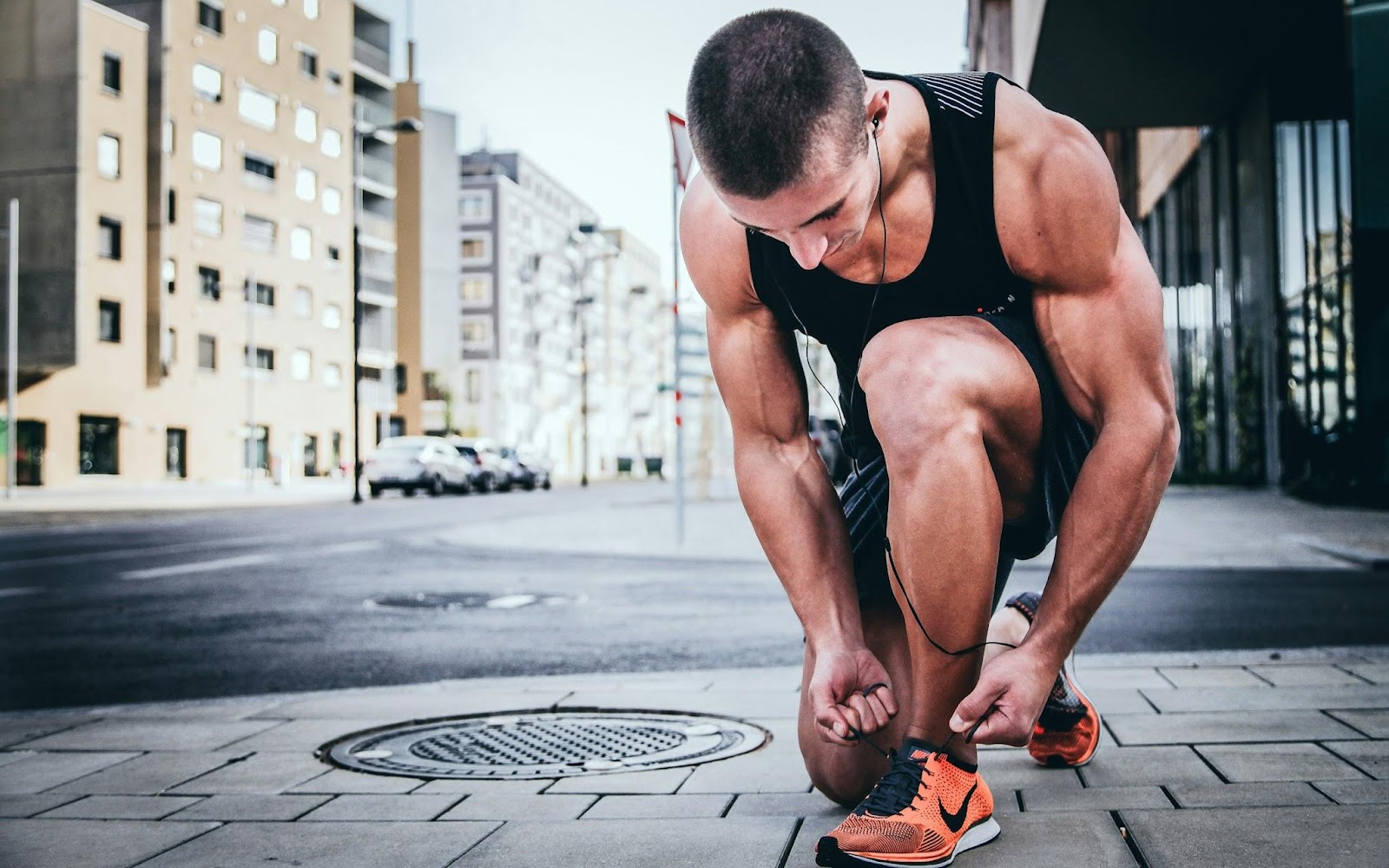 man tying shoelaces