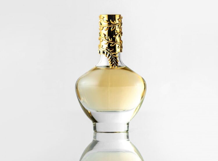 A front view light bottle with golden cap isolated on the white floor
