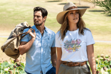 Girl wearing a hat and a boy wearing a blue shirt, holding a bag in his hands