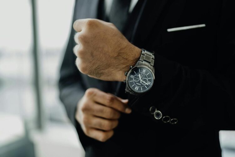 Man in Black Suit Wearing a Chronograph Watch