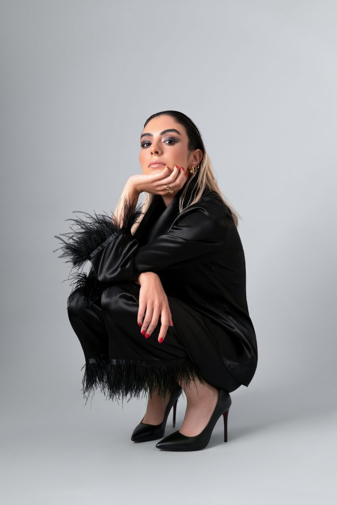 Woman wearing a silk pajama and heels