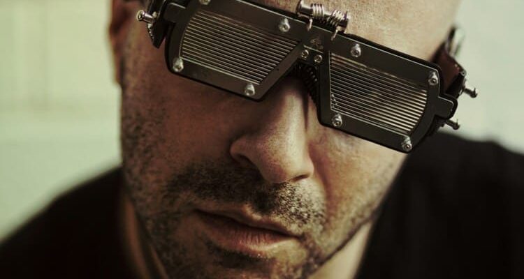 a man wearing a pair of metal glasses