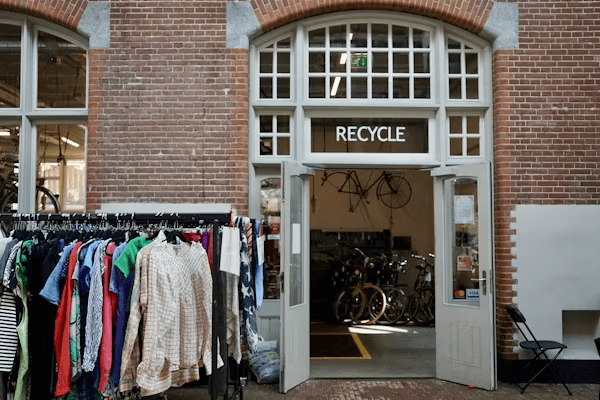 Bicycle shop with sustainable fashion clothing rack