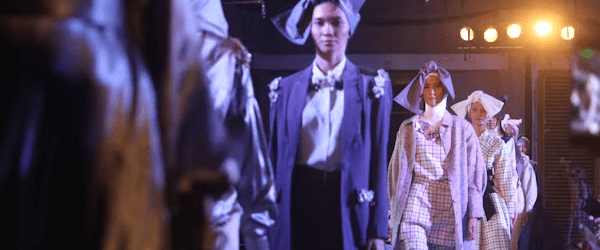 Fashion week attendees walking down runway
