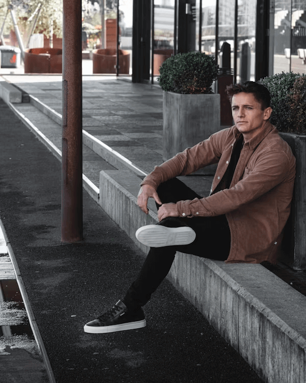 Man on bench holding frisbee