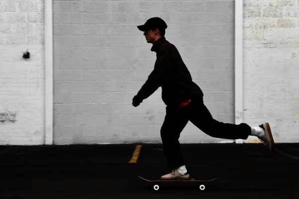 Man skateboarding in parking lot