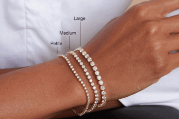 Woman wearing a white shirt with tennis bracelets on wrist
